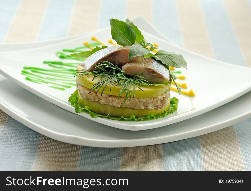 Appetizer of herring with apples with greens. Appetizer of herring with apples with greens