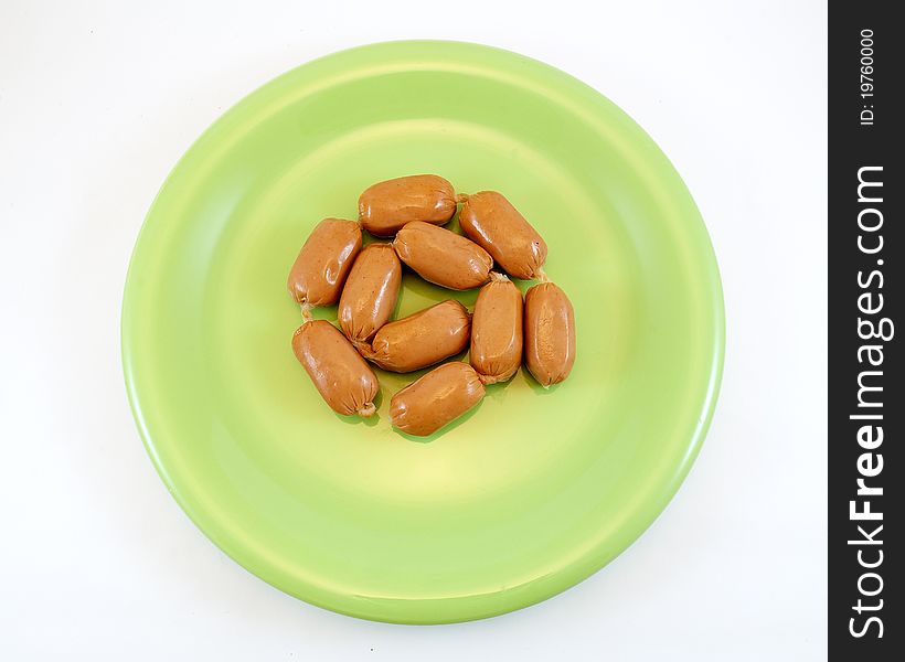 Frankfurters in green bowl on white background. Frankfurters in green bowl on white background