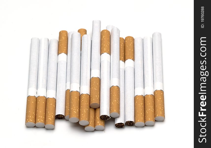 A lot of cigarettes isolated on white. A lot of cigarettes isolated on white