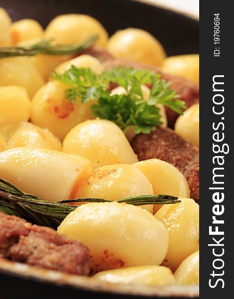 Pan-roasted minced meat kebabs and potatoes. Pan-roasted minced meat kebabs and potatoes