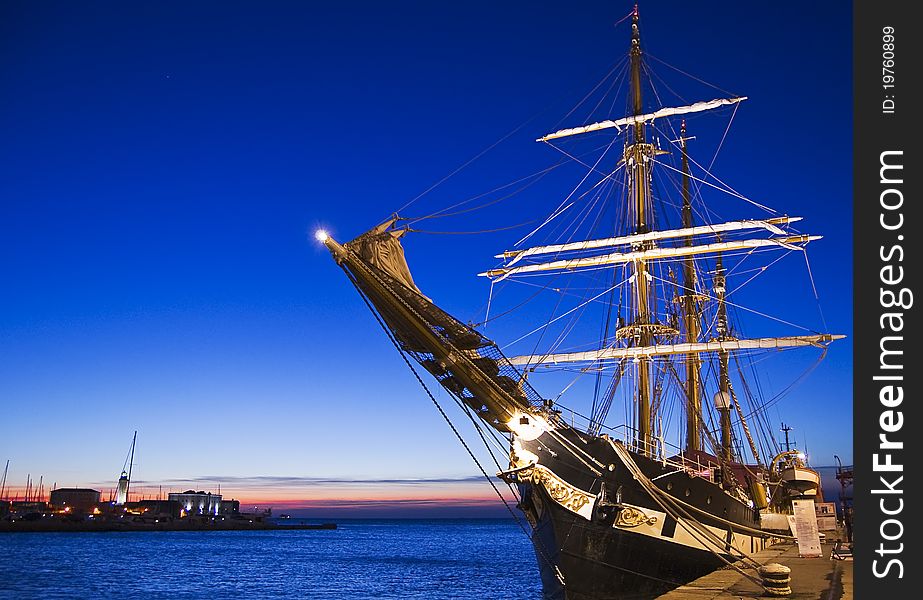 Moored sailing ship at sunset. Moored sailing ship at sunset