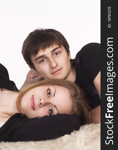Portrait of a cute young couple on carpet. Portrait of a cute young couple on carpet