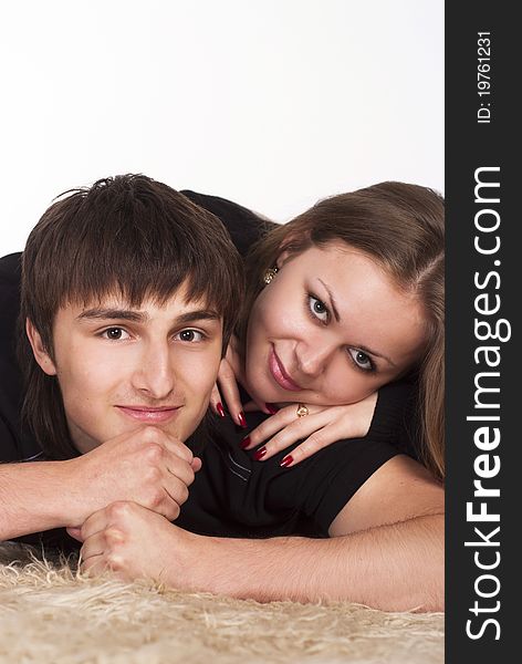Portrait of a cute young couple on carpet. Portrait of a cute young couple on carpet