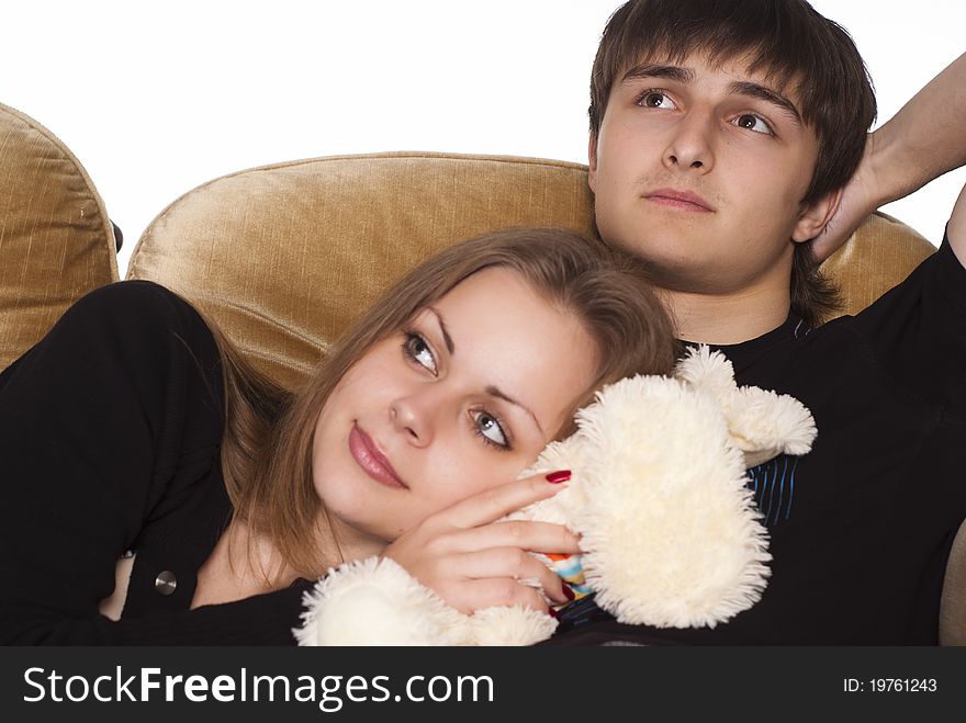 Portrait of a cute young couple on sofa. Portrait of a cute young couple on sofa