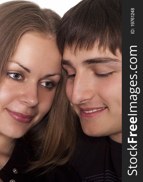 Portrait of a cute young couple on a white background. Portrait of a cute young couple on a white background