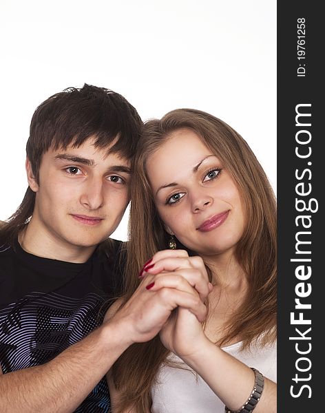 Portrait of a cute young couple on a white background. Portrait of a cute young couple on a white background