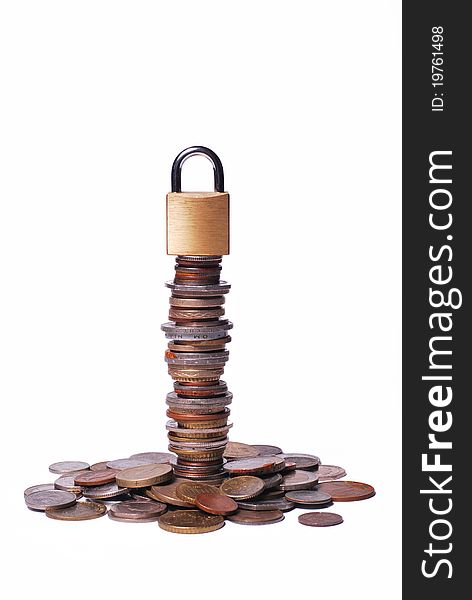 A closed lock on a tower of coins. A closed lock on a tower of coins