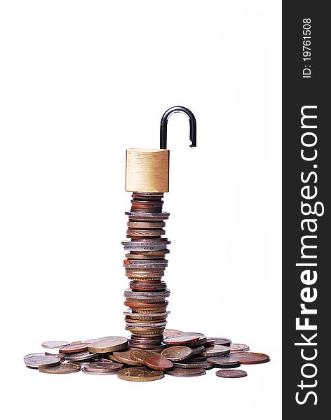 An open lock on top of a stack of coins. An open lock on top of a stack of coins