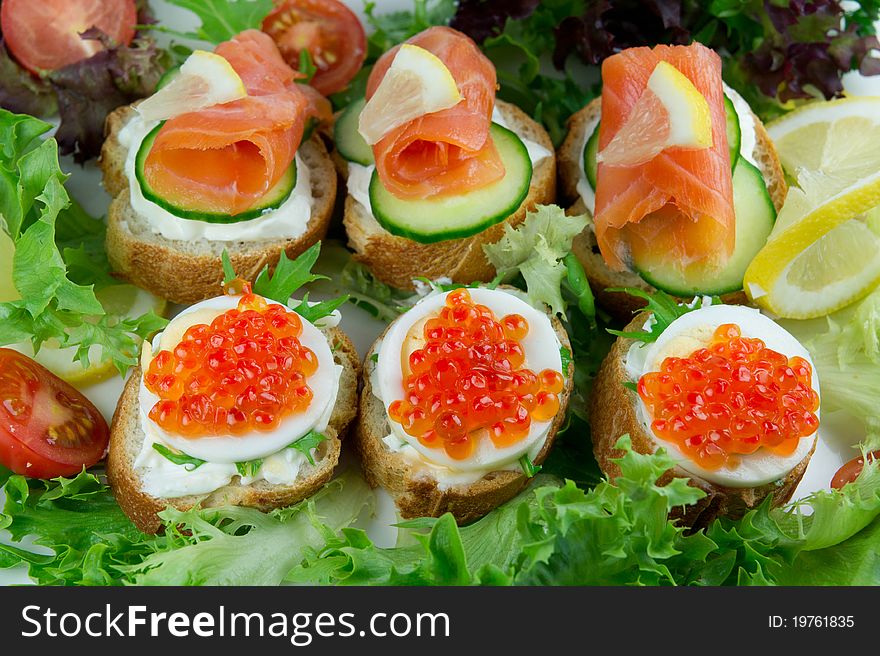 Red caviar and salmon sandwiches. Red caviar and salmon sandwiches