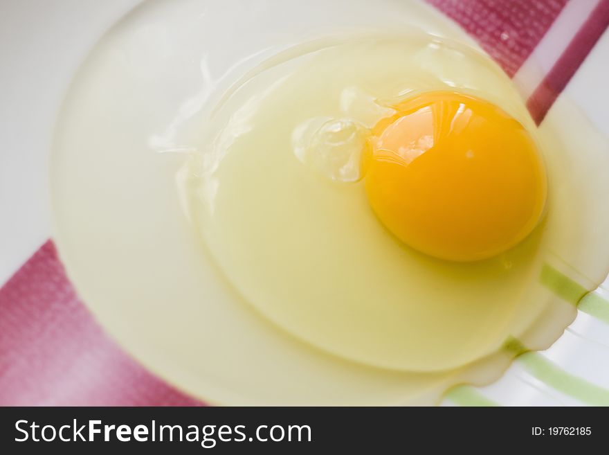 Raw egg in the dish, prepared for cooking