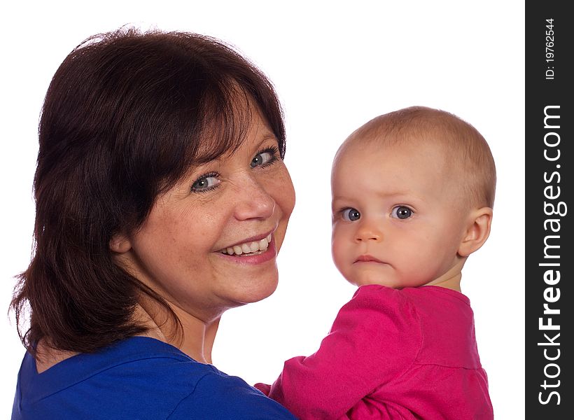 A grandmother enjoying her grand baby. A grandmother enjoying her grand baby