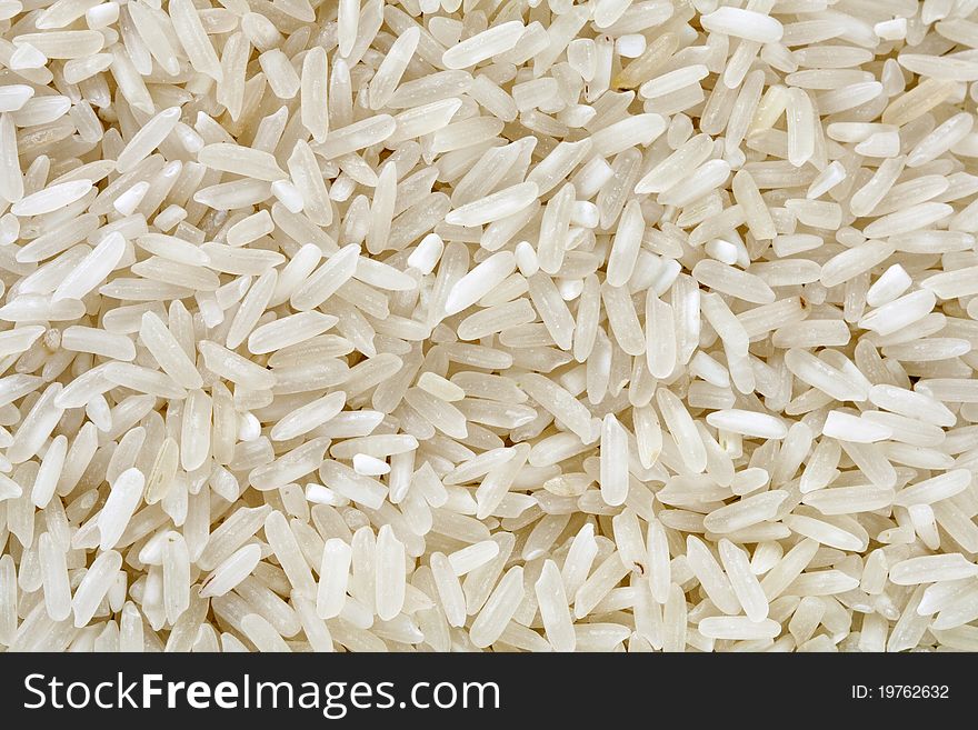 Background of raw rice grain.