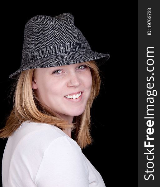 A pretty young girl in her early twenties with a beautiful look on her face and wearing a hat. A pretty young girl in her early twenties with a beautiful look on her face and wearing a hat.