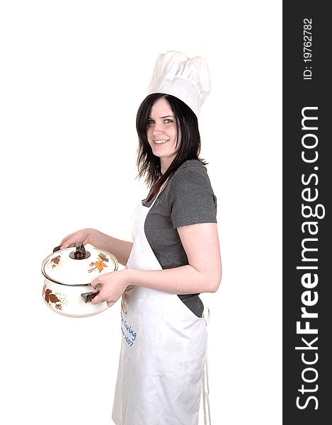 A pretty young woman, holding a cook pot, standing with an apron, black hair and a cook hat for white background. A pretty young woman, holding a cook pot, standing with an apron, black hair and a cook hat for white background.