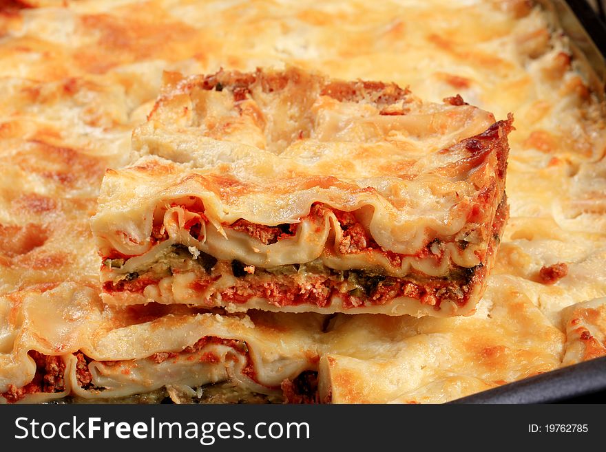 Detail of tasty lasagna in a baking pan