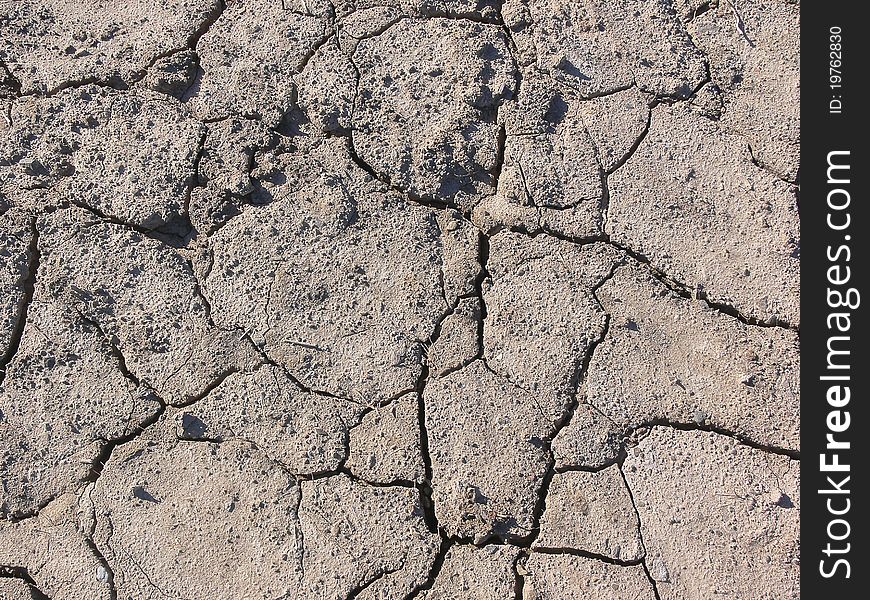 Broken soil in the field after a long dry summer, missing water to get fertile again. Broken soil in the field after a long dry summer, missing water to get fertile again.