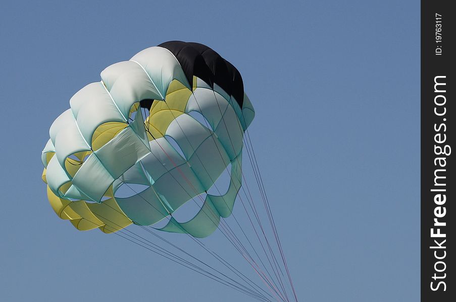 Parasailing chute open against the blue sky in bahamas