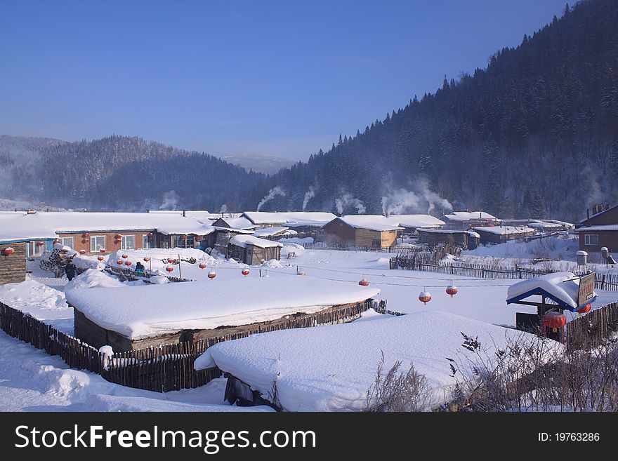 A village in northern China, covered by heavy snow with temperature below -30 degrees centigrade. A village in northern China, covered by heavy snow with temperature below -30 degrees centigrade.