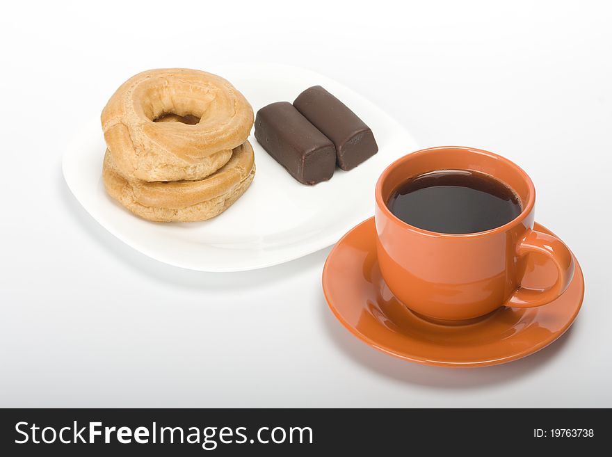 Coffee cup and cake in saucer