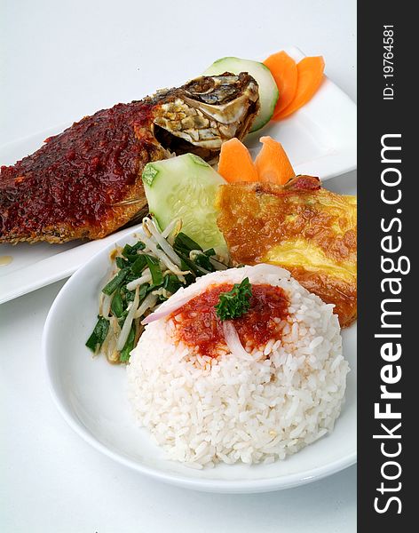 Rice with spicy fish curry and vegetables. Rice with spicy fish curry and vegetables