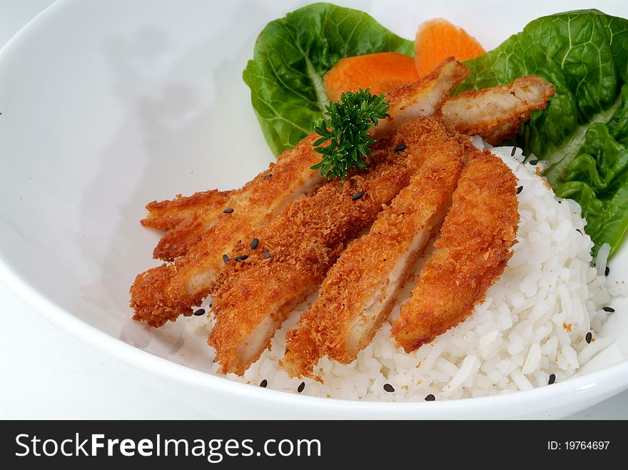 Fried meat serve with white rice. Fried meat serve with white rice