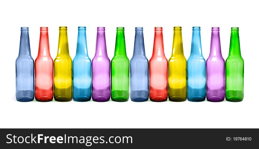 Many multicolored bottles isolated on white
