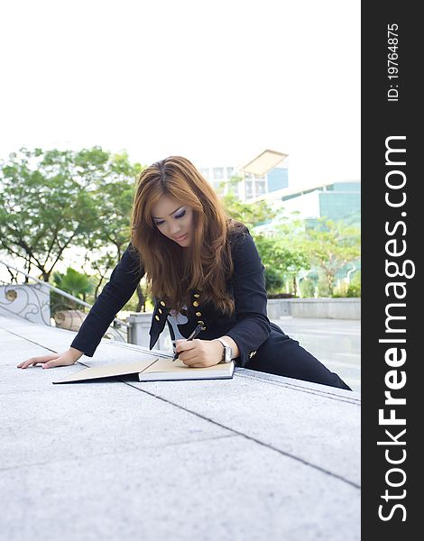 Young Beautiful Woman Sitting On Stairs