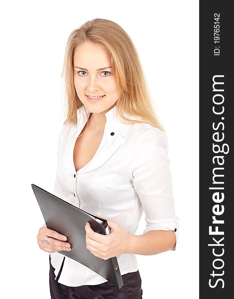 Young business woman standing with folder and smiling. Young business woman standing with folder and smiling