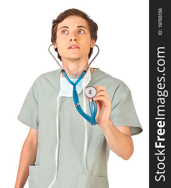 Young doctor standing and listening to stethoscope. Young doctor standing and listening to stethoscope