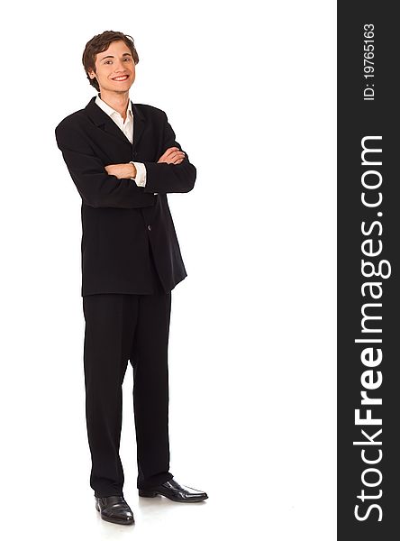 Confident young business man standing and smiling