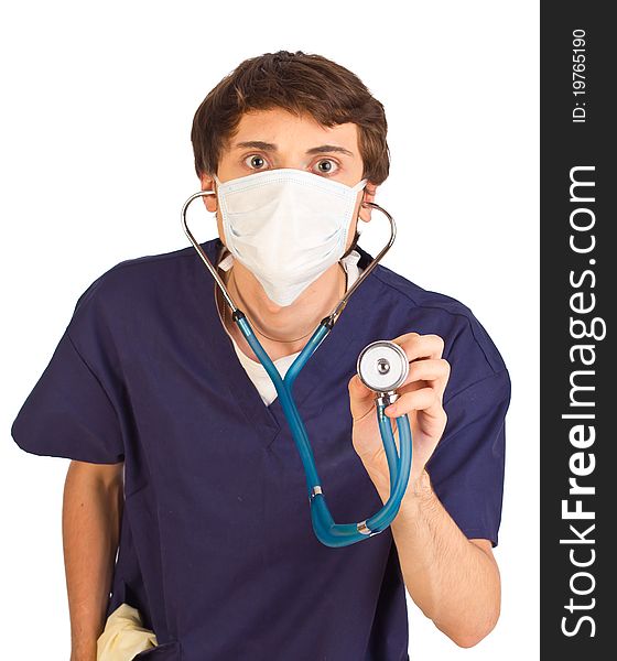 Worried medical worker holding stethoscope with eyes wide open