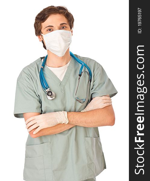 Attractive young male doctor standing with arms locked and looking straight in camera. Attractive young male doctor standing with arms locked and looking straight in camera