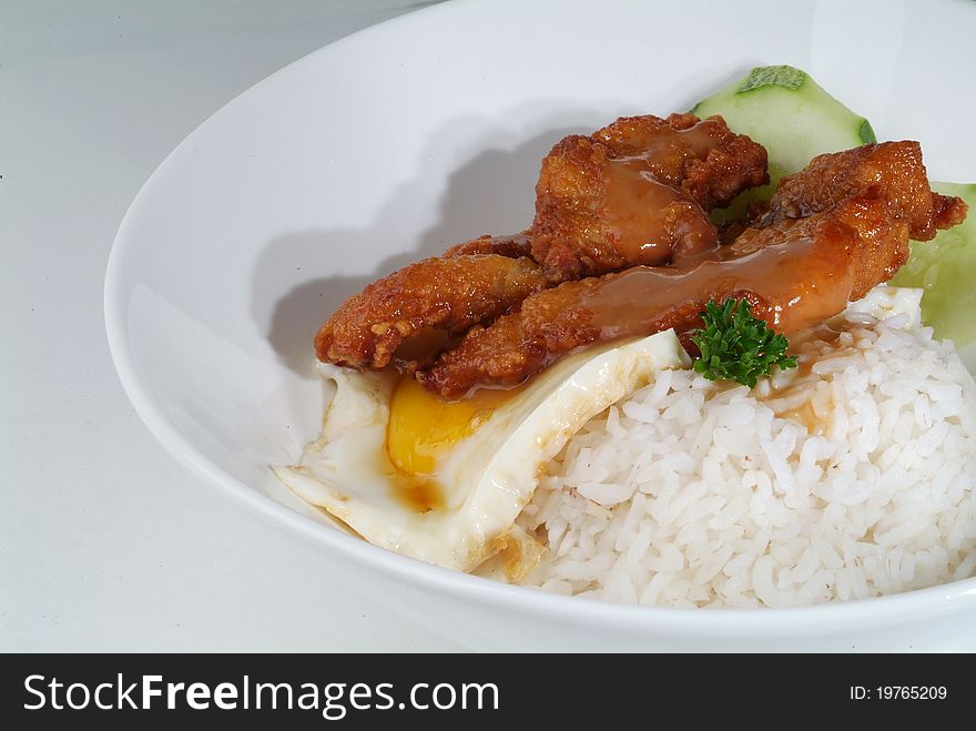 Fried meat serve with white rice. Fried meat serve with white rice