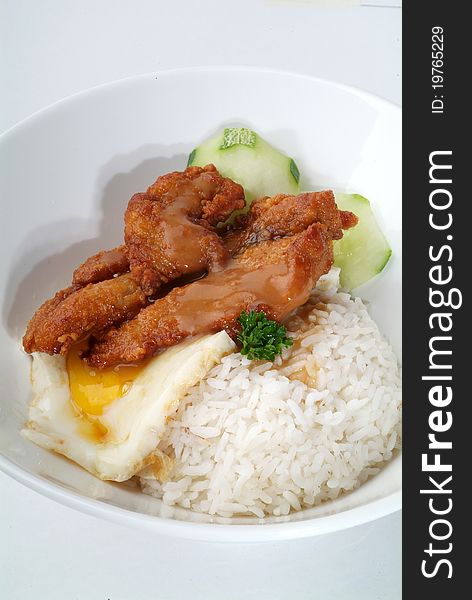 Fried meat serve with white rice. Fried meat serve with white rice