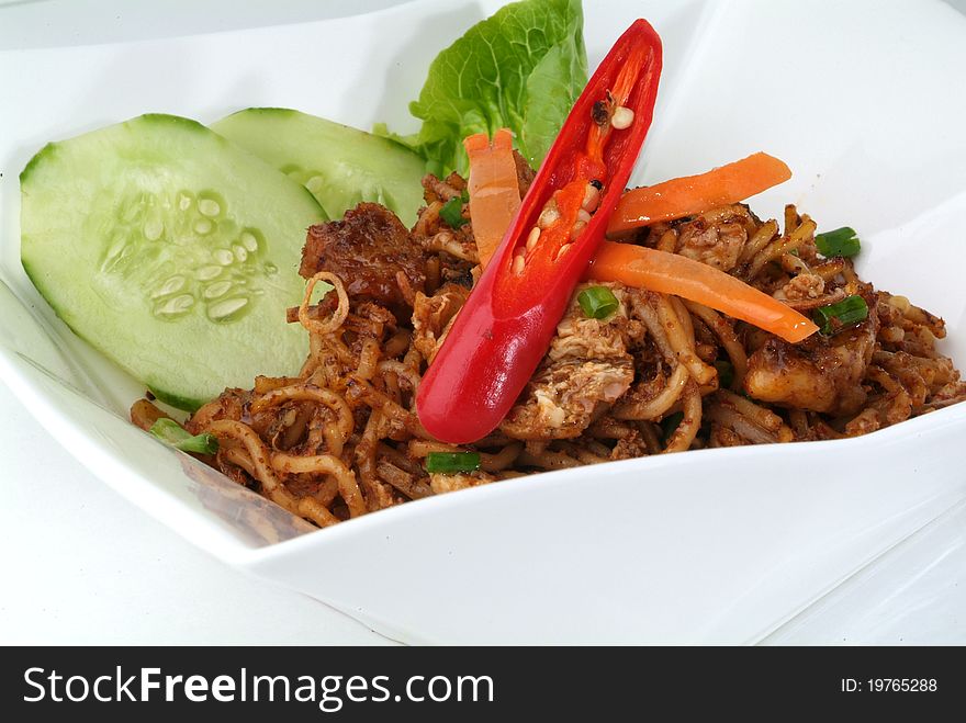 Spicy Malay style fried noodles. Made with various ingredients and vegetables. For concepts such as healthy eating and lifestyle, and food and beverage.