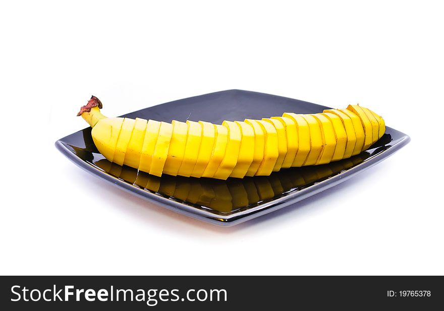 Banana on a plate. Objects on a white background.