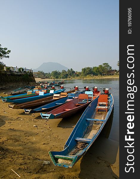 A group of Long-tailed Boat in Song River at VangVieng, Lao