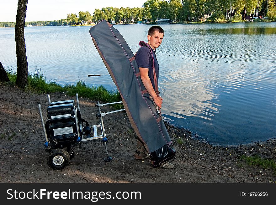 Going angler with the entire fishing accessories to the position