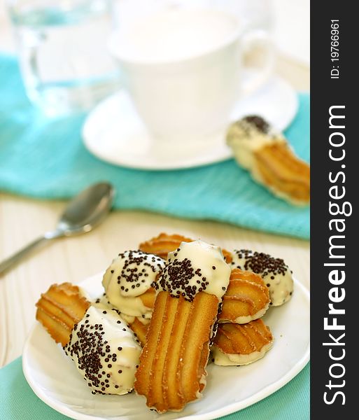 Cookies with white and black chocolate on plate