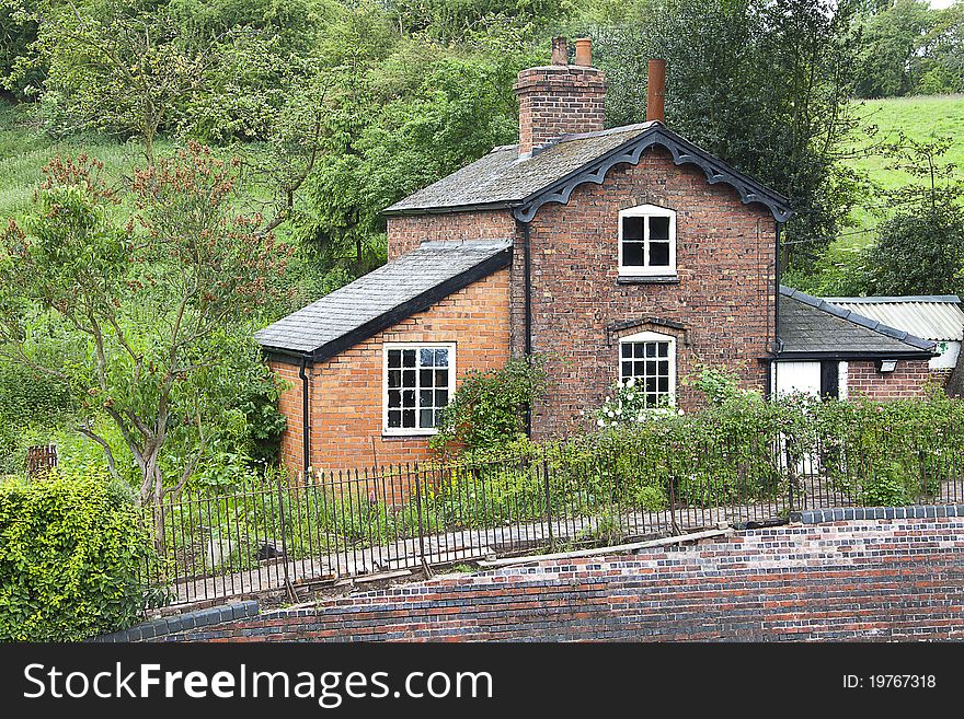 Old traditional English brick built railway cottage.
