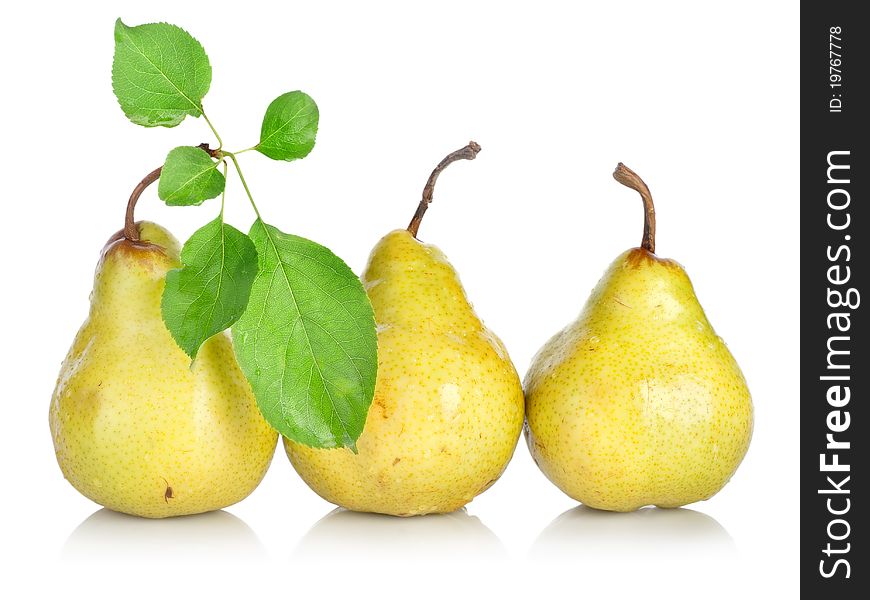 Yellow pears with green leafs isolated on white background