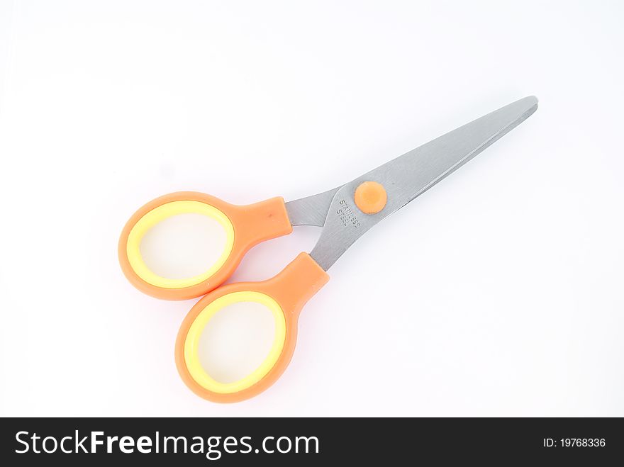 Orange children scissors on white background. Orange children scissors on white background