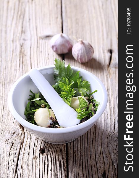 Mortar and pestle with ingredients ready to be ground