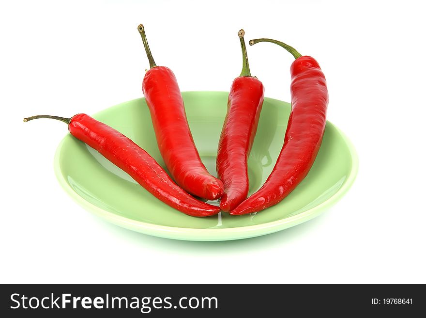 Fresh red hot pepper on a white