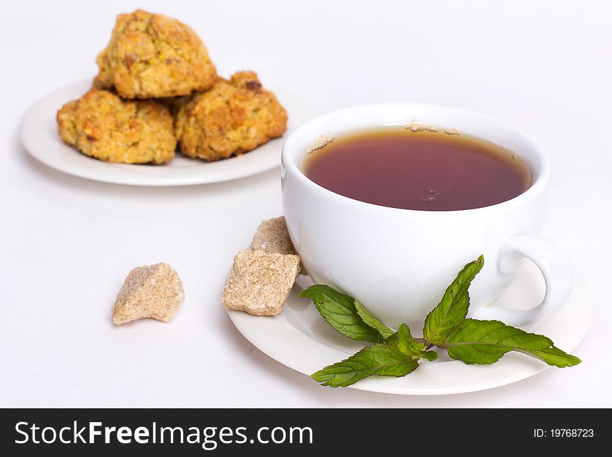 Black tea with biscuits isolated on white