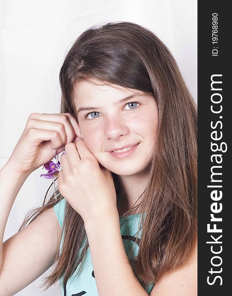 Young girl adjusting her earring