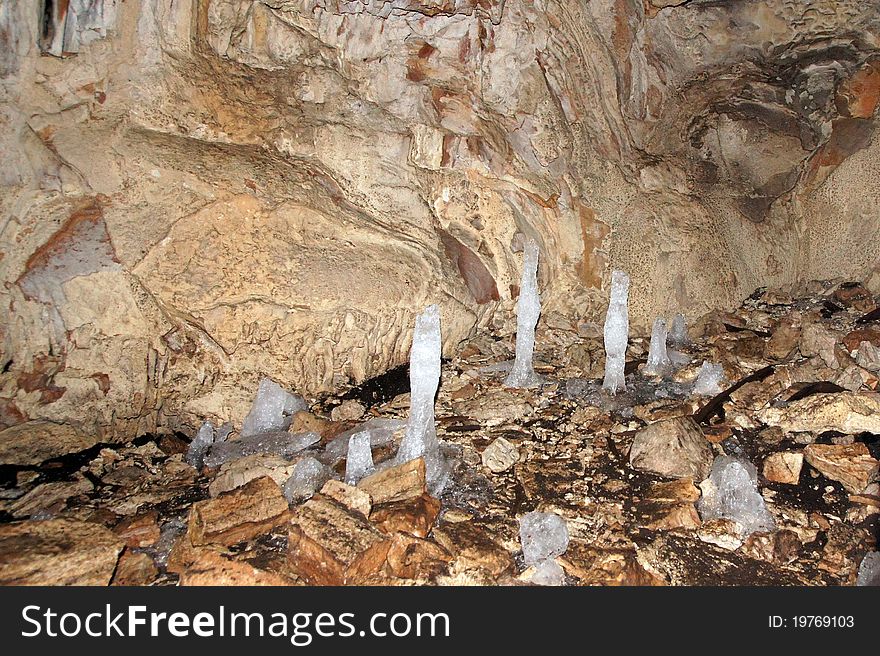 Ice stalagmites at the bottom of the cave in the Crimea. Ice stalagmites at the bottom of the cave in the Crimea