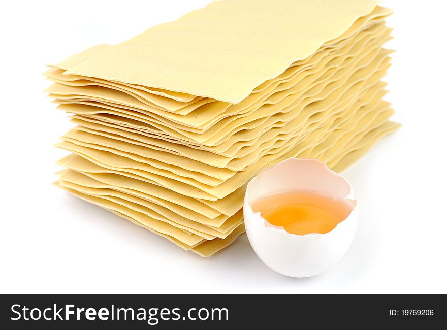 An image of yellow lasagna and an egg