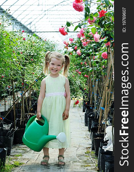 An image of a girl with a watering can