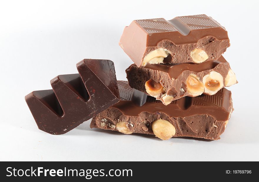 Chocolate pieces on white background